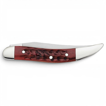 Razor Sharp AZ Case Pocket Worn Old Red Bone Small Texas Toothpick knife with a jigged red handle and clip blade.