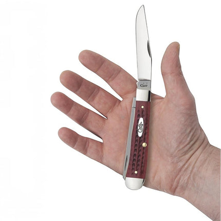 Razor Sharp AZ Case Trapper knife with red bone corn cob jigged handle and stainless steel blades held in a hand