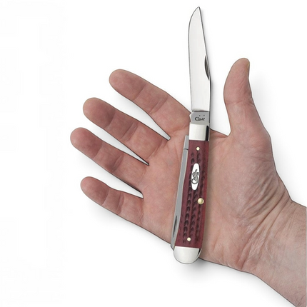 Razor Sharp AZ Case Trapper knife with red bone corn cob jigged handle and stainless steel blades held in a hand