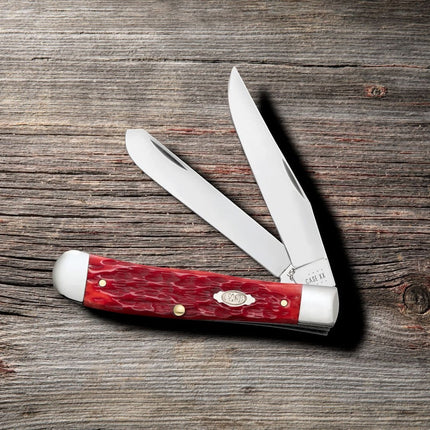 Razor Sharp AZ Case Peach Seed jigged dark red bone handle trapper knife with two mirror-polished carbon steel blades