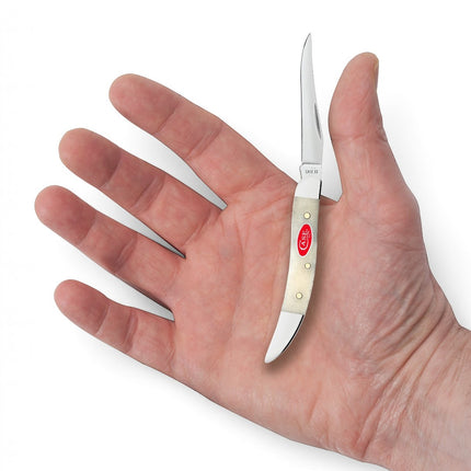 Razor Sharp AZ Case Smooth Natural Bone Small Texas Toothpick knife with a mirror-polished clip blade in a hand.