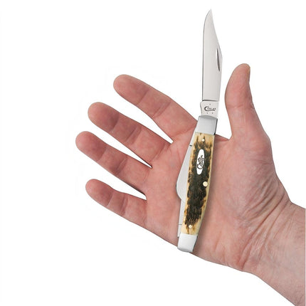 Razor Sharp AZ Case Large Stockman knife with peach seed jigged amber bone handle and carbon steel blades in hand