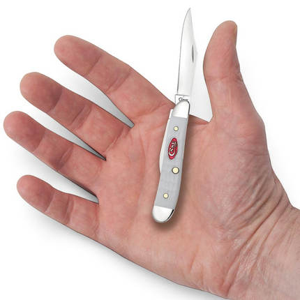 Razor Sharp AZ Case SparXX white synthetic peanut pocket knife with mirror-polished blades held in a person's palm