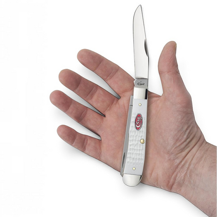 Razor Sharp AZ Case SparXX Trapper knife with jigged white synthetic handle and red shield held in a hand