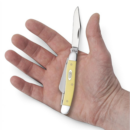 Razor Sharp AZ Case Yellow Synthetic Medium Stockman pocket knife with stainless steel blades held in a hand