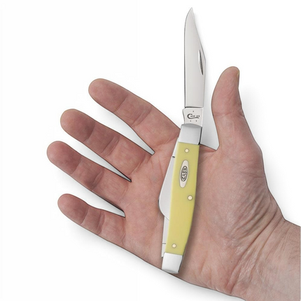 Razor Sharp AZ Case Yellow Synthetic Large Stockman pocket knife with carbon steel blades held in a person's hand