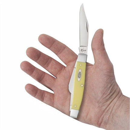 Razor Sharp AZ Case Yellow Synthetic Large Stockman pocket knife with carbon steel blades held in a person's palm.