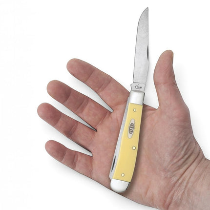 Razor Sharp AZ Case Yellow Synthetic Trapper pocket knife with stainless steel blade held in a hand