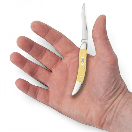Razor Sharp AZ Case Yellow Synthetic Small Texas Toothpick pocket knife with mirror-polished clip blade in a hand