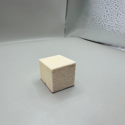 Razor Sharp AZ Rock Hard Deburring Felt Block, 1x1 inch square, cream color, for knife and tool sharpening, removes burrs without dulling edge.