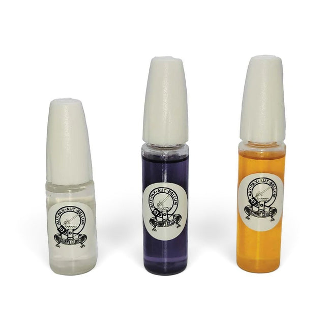 Razor Sharp AZ Gunny Glide graphene lubricant bottles in clear, purple, and amber for precision hardware maintenance.