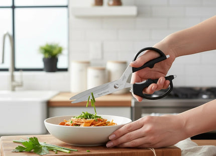 Razor Sharp AZ Kai 2pc Shears Set, stainless steel kitchen and multi-purpose shears with black handles, cutting chives over pasta.