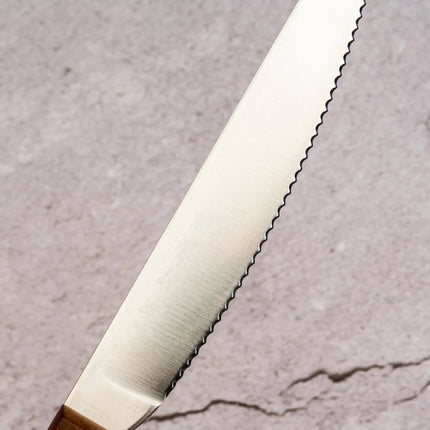 Razor Sharp AZ Kanetsune serrated stainless steel spread knife with a warm maple wood handle for charcuterie boards