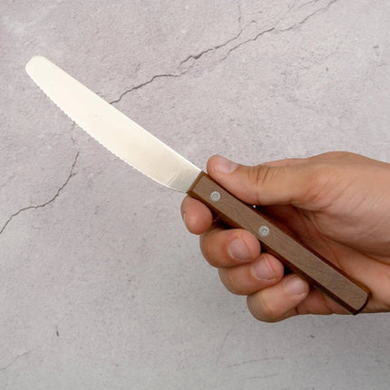 Razor Sharp AZ Kanetsune spread knife with a serrated stainless steel blade and a durable Kebony maple wood handle.