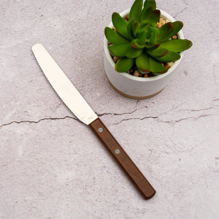 Razor Sharp AZ Kanetsune spread knife with a serrated stainless steel blade and a durable Kebony maple wood handle.