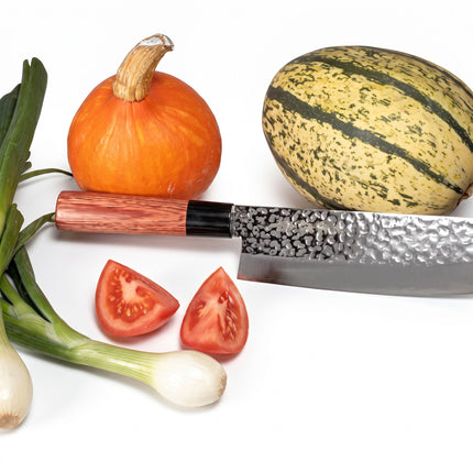 Razor Sharp AZ Kanetsune Usubagata knife with hammered stainless steel blade and wood handle next to fresh vegetables