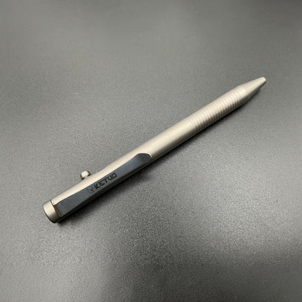 Razor Sharp AZ Ketuo Halo bolt action pen in gray titanium with textured grip and bolt mechanism.