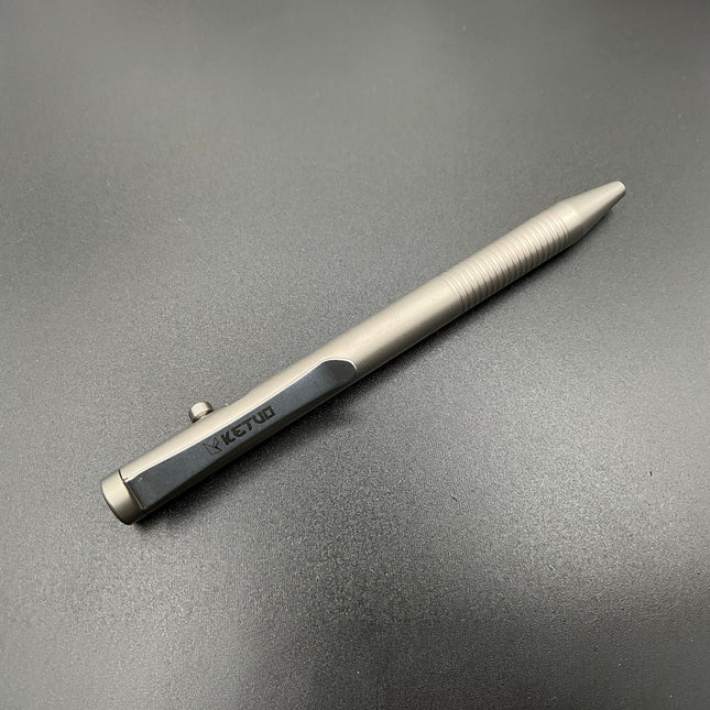 Razor Sharp AZ Ketuo Halo bolt action pen in gray titanium with textured grip and bolt mechanism.