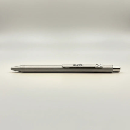 Razor Sharp AZ Ketuo KP03 titanium push pen in stonewash finish with laser-etched logo and no clip.