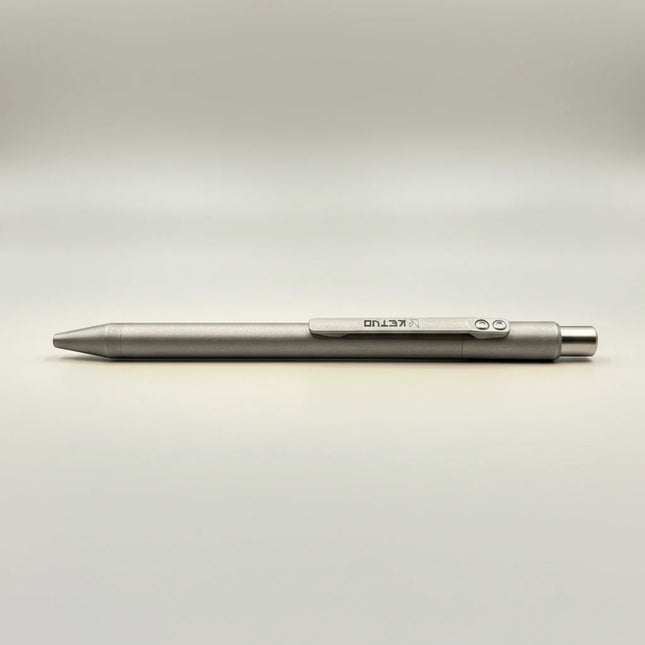 Razor Sharp AZ Ketuo KP03 titanium push pen in stonewash finish with laser-etched logo and no clip.