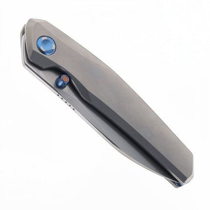 Razor Sharp AZ Poikilo Blade VK-Zen S1 folding knife with pearlescent stonewashed titanium handle and blue thumb stud.