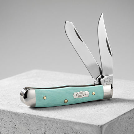 Razor Sharp AZ Case Tiny Trapper knife with seafoam green G-10 handles, Ichthus shield, and two stainless steel blades.