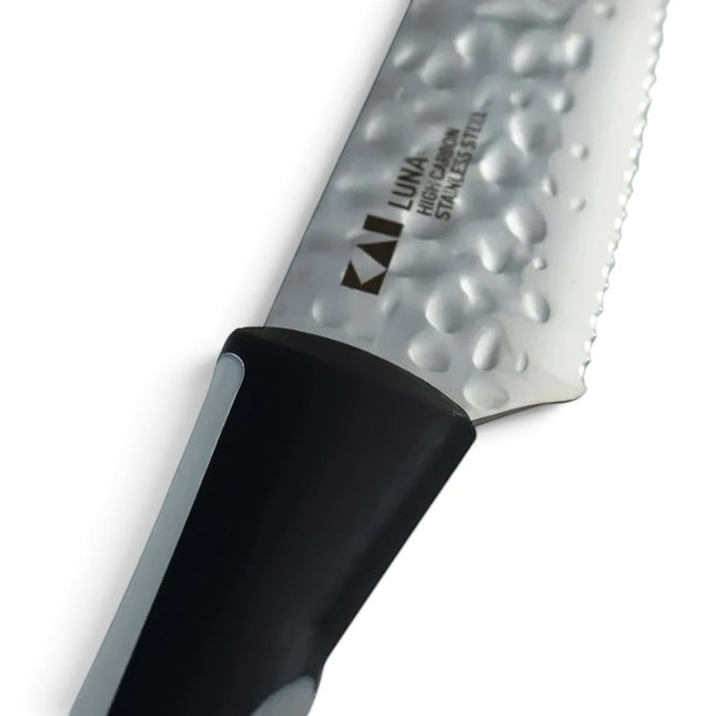 Razor Sharp AZ 4-inch serrated citrus knife with a hammered stainless steel blade and black ergonomic handle
