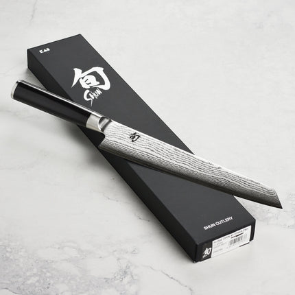Razor Sharp AZ Shun Classic 9" Master Prep Knife with Damascus blade and ebony PakkaWood handle.