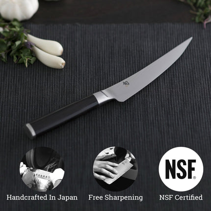 Razor Sharp AZ Shun Classic 6-inch boning and fillet knife with a Damascus steel blade and black PakkaWood handle.