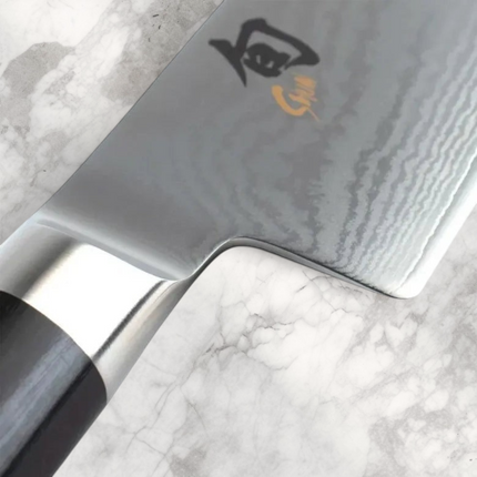 Razor Sharp AZ Shun Classic 8-inch chef's knife featuring a Damascus steel blade and black ebony PakkaWood handle.
