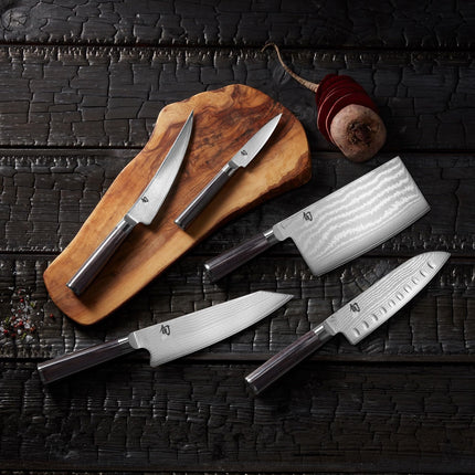 Razor Sharp AZ Shun Classic knife set featuring Damascus steel blades and ebony PakkaWood handles on a wooden board.