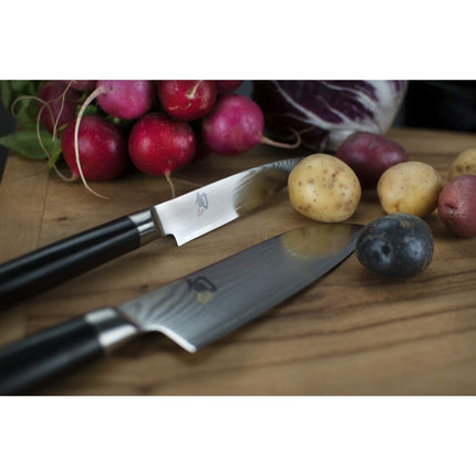 Razor Sharp AZ Shun Classic paring and utility knives with Damascus steel blades and black PakkaWood handles on wood