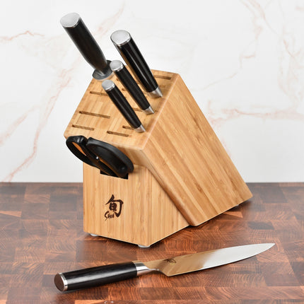 Razor Sharp AZ Shun Classic 8" Kiritsuke Knife with black PakkaWood handle and Damascus blade, in bamboo block.