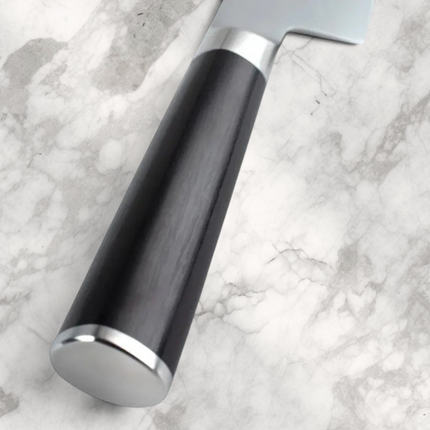 Razor Sharp AZ Shun Classic chef's knife featuring a black D-shaped PakkaWood handle and stainless steel bolster