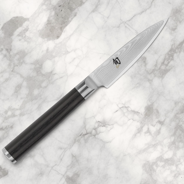 Razor Sharp AZ Shun Classic 3.5-inch paring knife with Damascus steel blade and black ebony PakkaWood D-shaped handle.