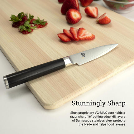 Razor Sharp AZ Shun Classic 3.5-inch paring knife with Damascus steel blade and black PakkaWood handle on wood board