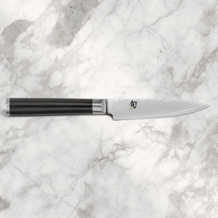 Razor Sharp AZ Shun Classic 3.5-inch paring knife with Damascus steel blade and black ebony PakkaWood D-shaped handle.