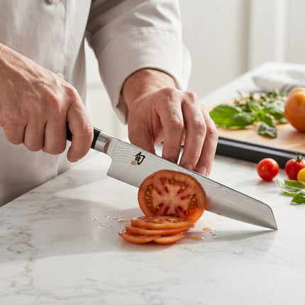 Razor Sharp AZ Shun Classic 9" Master Prep Knife with Damascus blade and black PakkaWood handle.