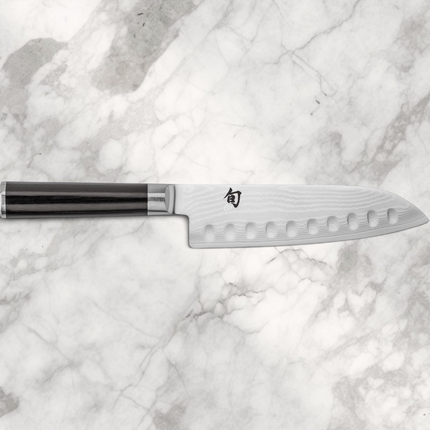 Razor Sharp AZ Shun Classic 7-inch hollow ground santoku knife with Damascus steel blade and ebony PakkaWood handle.