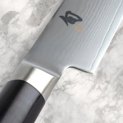 Razor Sharp AZ Shun Classic 6-inch utility knife featuring a Damascus steel blade and black PakkaWood handle