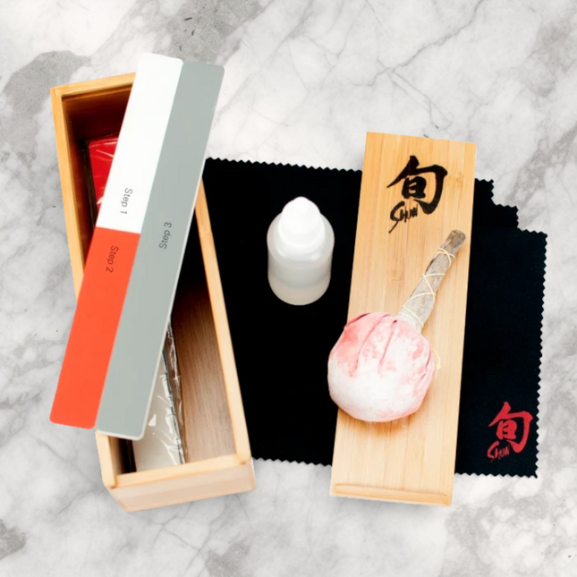 Razor Sharp AZ Shun Knife Care Kit with polishing cloths, sticks, oil, talc ball, and bamboo box.