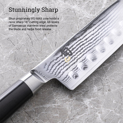 Razor Sharp AZ Shun Classic 7-inch Santoku knife featuring a Damascus steel blade with hollow ground indentations.