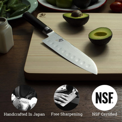 Razor Sharp AZ Shun Classic 7-inch hollow ground Santoku knife with Damascus steel blade and ebony PakkaWood handle.