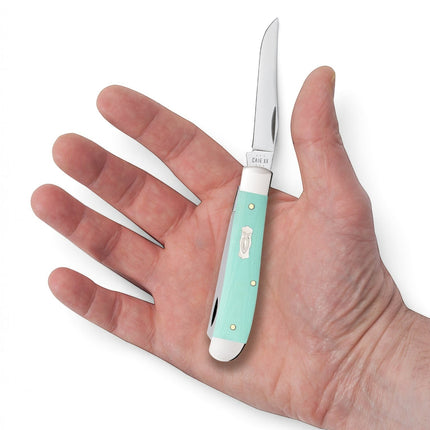 Razor Sharp AZ Case Mini Trapper pocket knife with a smooth Tiffany Blue G-10 handle and Ichthus fish shield in hand