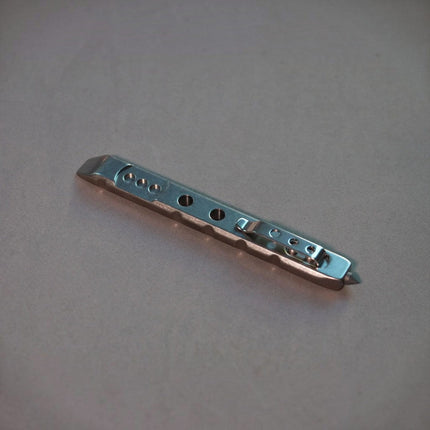 Razor Sharp AZ Ti-Pry titanium pocket pry bar with integrated pocket clip and tungsten carbide glass breaker tip.