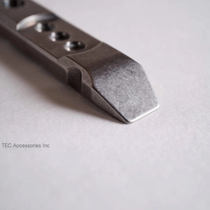 Razor Sharp AZ Ti-Pry titanium pocket pry bar showing the durable machined metal tip and compact design