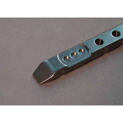 Razor Sharp AZ Ti-Pry Pocket Edition titanium pry bar featuring a machined metal finish and integrated design details.