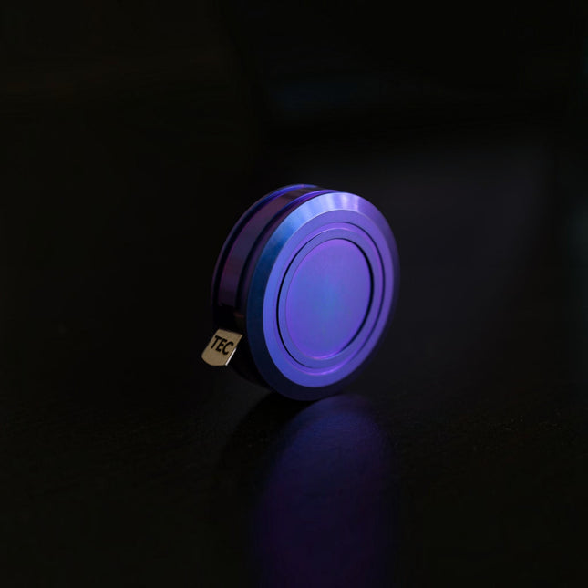 Razor Sharp AZ TEC Accessories Ti-Tape titanium tape measure in blue raspberry anodized finish on a dark surface