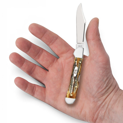 Razor Sharp AZ Case 6.5 BoneStag Mini CopperLock pocket knife with a jigged bone handle held in a person's palm.